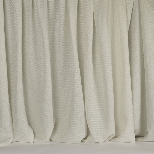 Soft fog white woven curtains with a subtle linen texture and gentle vertical folds