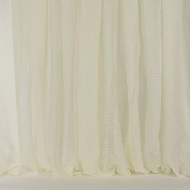 Soft cream sheer curtain fabric with fine vertical texture and gentle folds