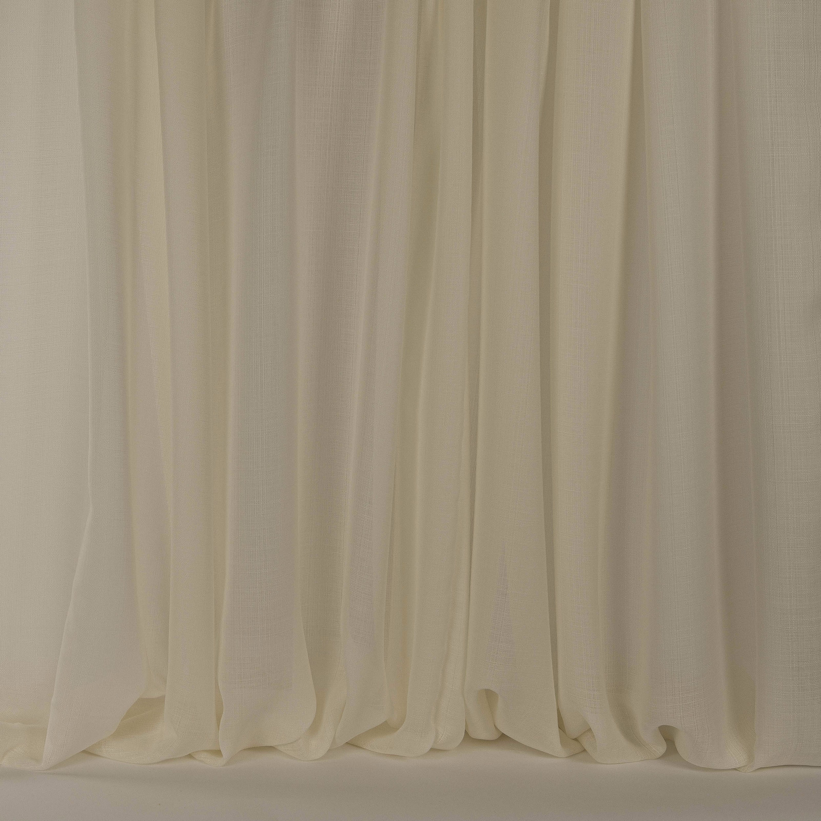 Warm cream sheer drapery with soft clay undertones and gentle fluid folds