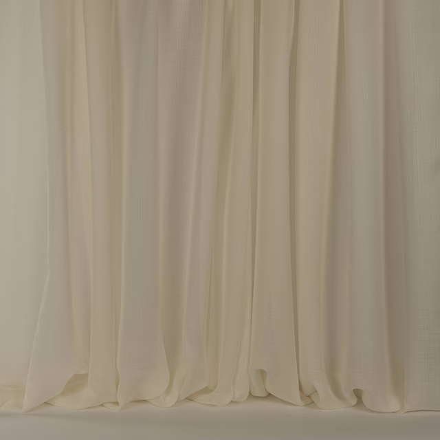Warm cream sheer drapery with soft clay undertones and gentle fluid folds