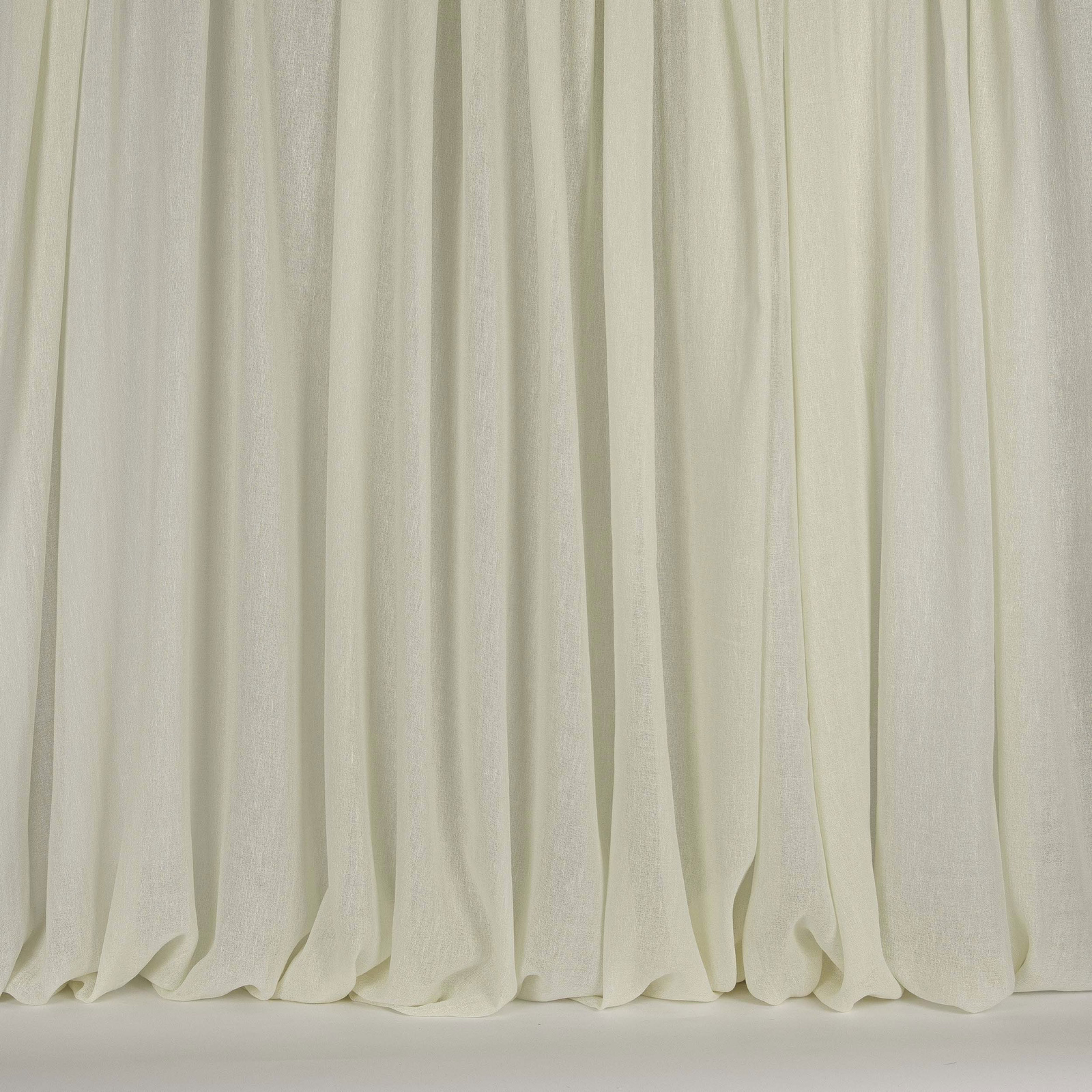 Pale bone cream drapery fabric hanging in soft vertical folds