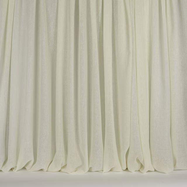 Pale bone cream drapery fabric hanging in soft vertical folds