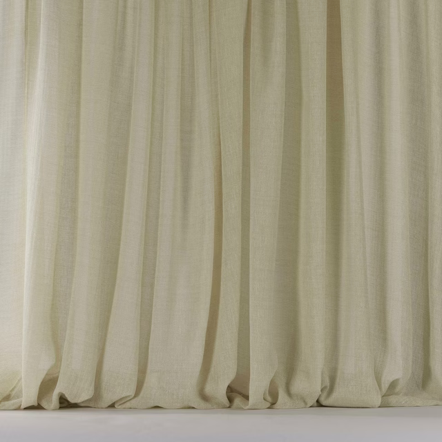 Soft warm beige linen-blend fabric hanging in gentle vertical folds