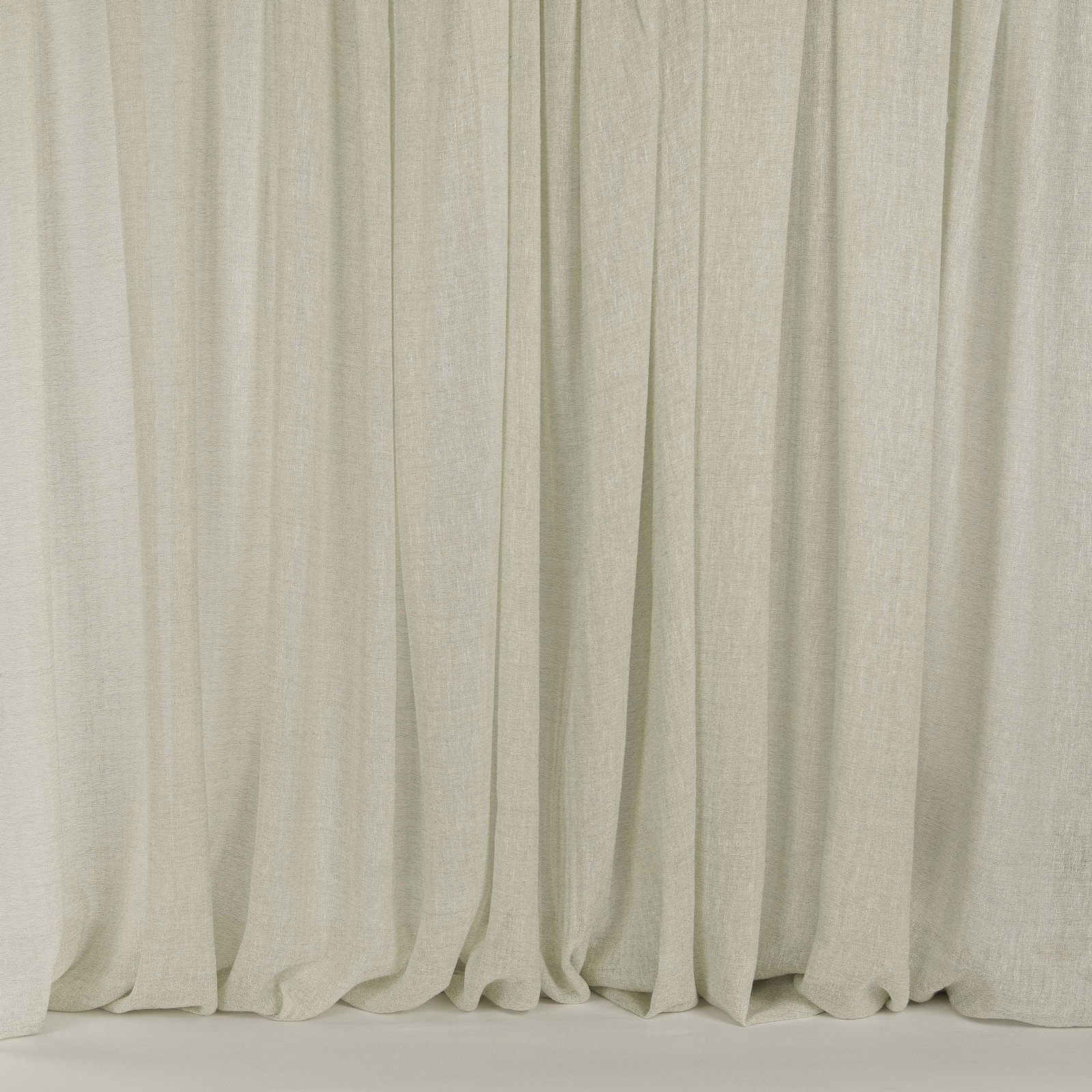 Pale creamy mastic fabric draped in soft vertical folds with a fine woven texture