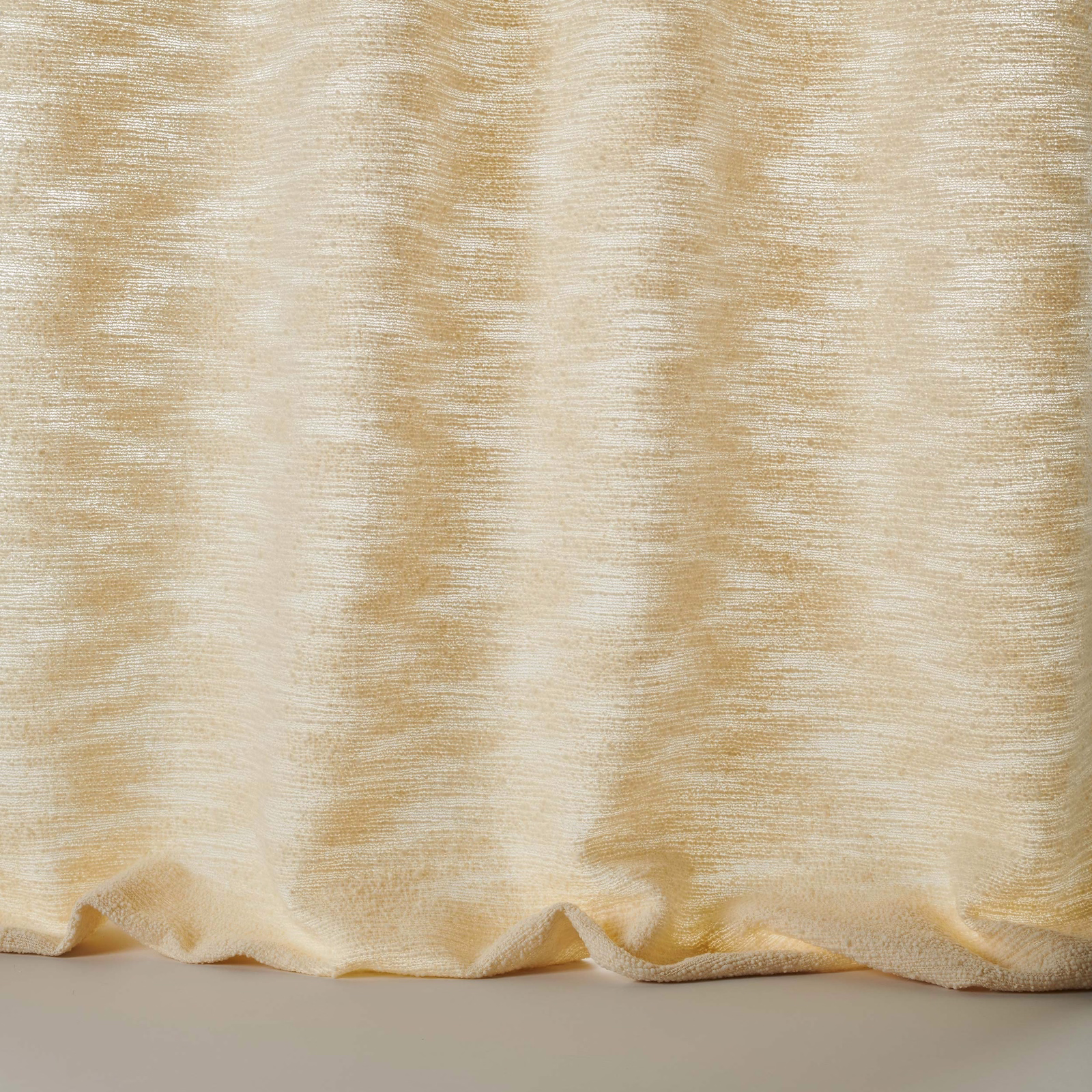 Warm cream textured fabric with soft rippled horizontal striations