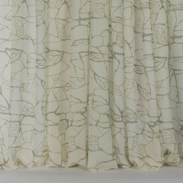 Cream drapery fabric with large abstract clay veining and soft vertical folds