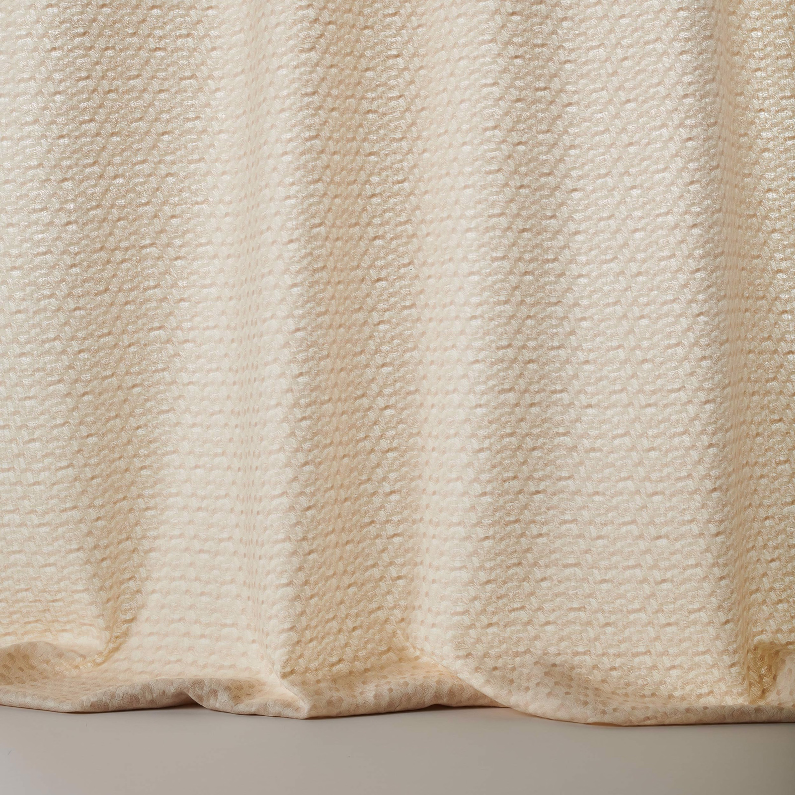 Creamy beige wool fabric with subtle vertical striped texture and soft drape