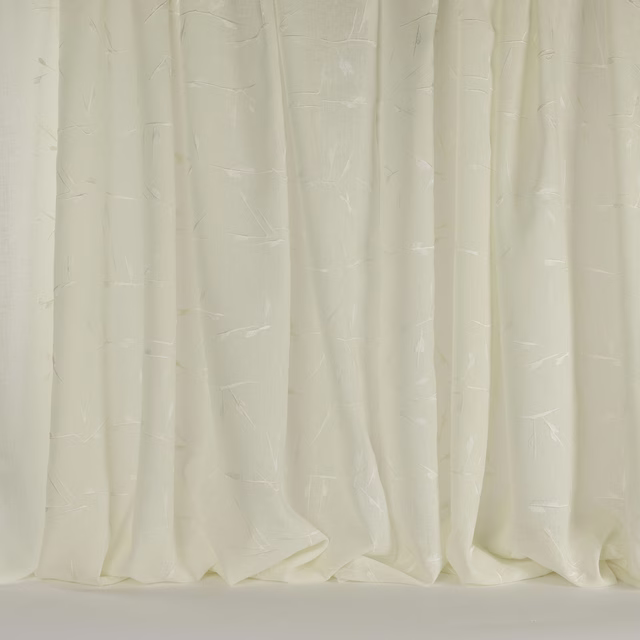 Cream fabric swatch with subtle geometric texture and soft vertical folds