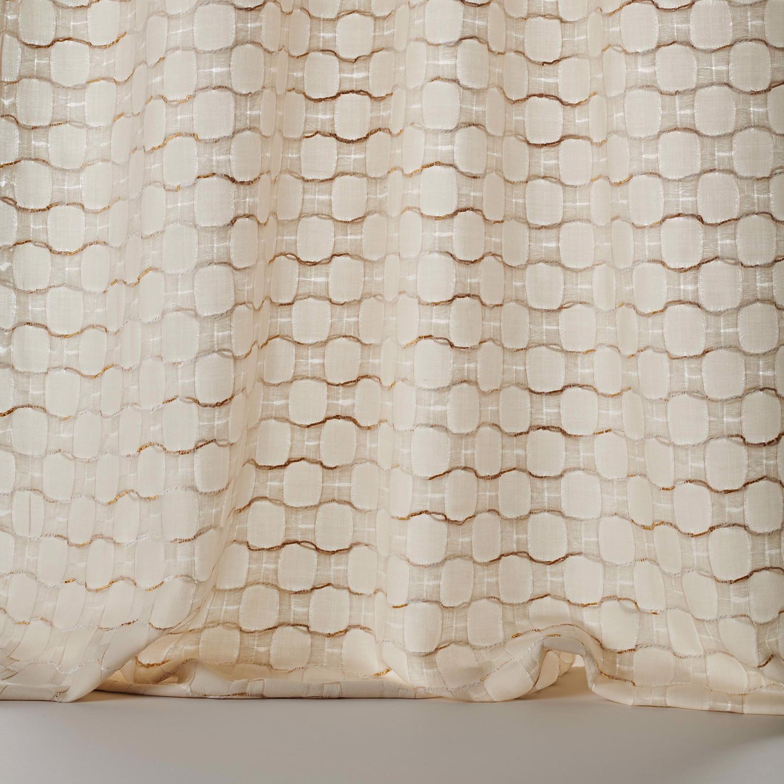 Cream and gold textured woven fabric with rounded geometric blocks and subtle slub detail