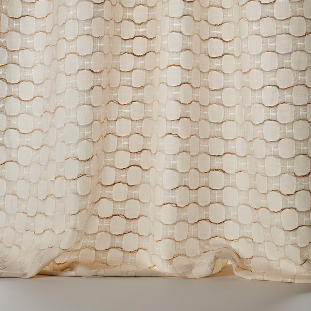 Cream and gold textured woven fabric with rounded geometric blocks and subtle slub detail