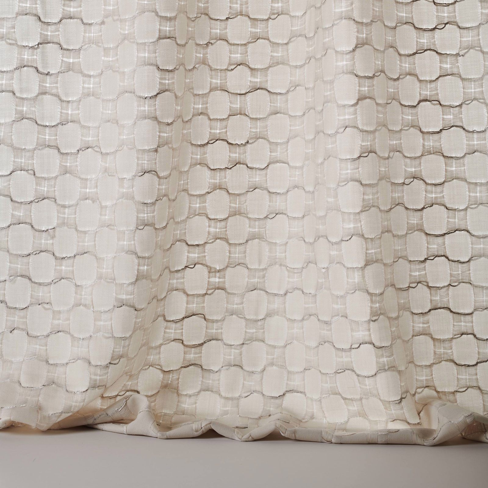 Pale silver-cream woven fabric with raised rounded textured pattern