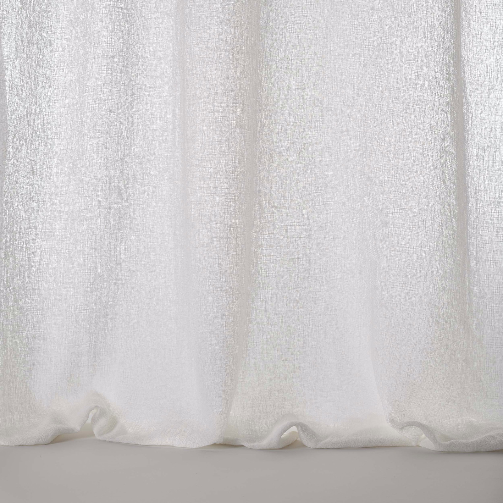 Pale bone-white woven fabric with a soft linen-like texture and gentle drape