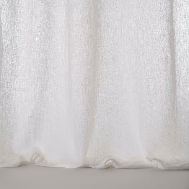 Pale bone-white woven fabric with a soft linen-like texture and gentle drape