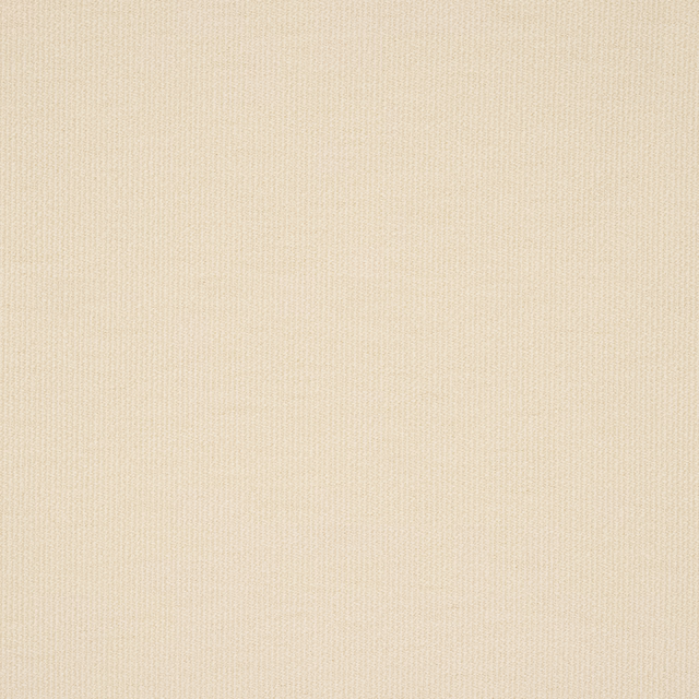 Close-up of a plain soft cream woven fabric with fine diagonal texture