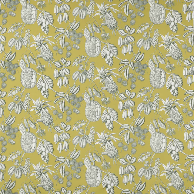 Yellow-green botanical cotton with pale leafy and fruit motifs on a dense ground
