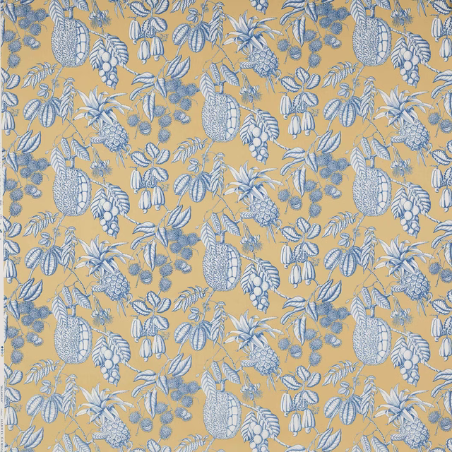 Blue botanical fruit and leaf print on warm ochre cotton fabric