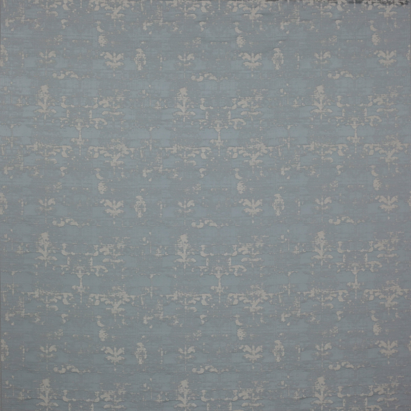 Muted slate blue damask fabric with a softly distressed pale motif