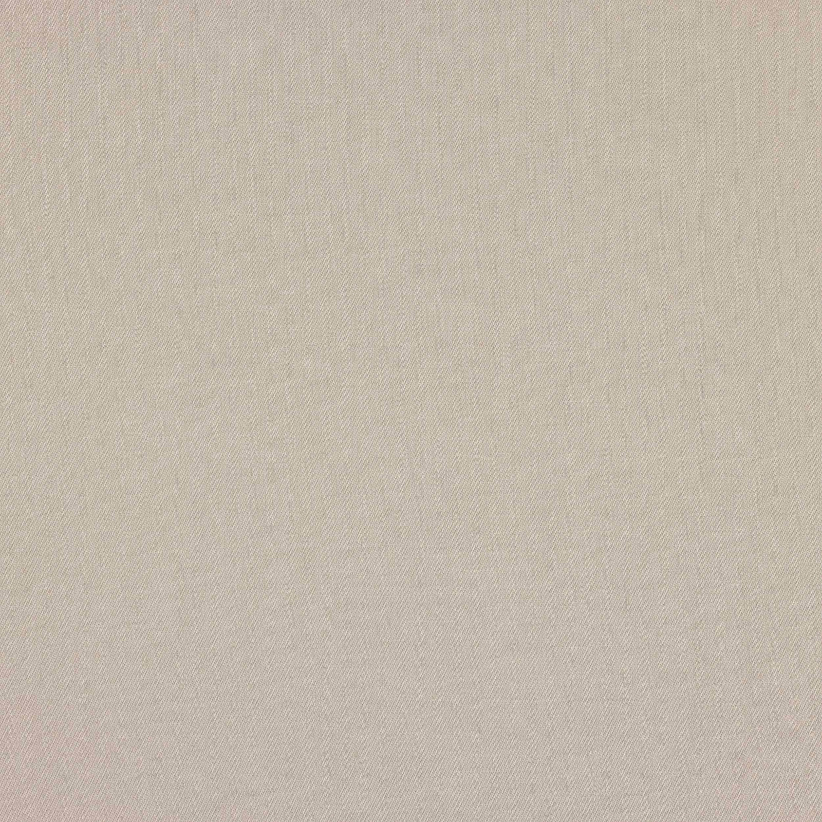 Close-up of soft cream linen fabric with a fine plain weave