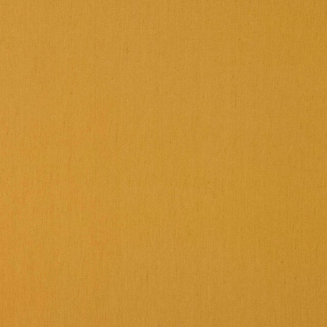 Plain warm nutmeg-gold linen swatch with a matte, natural texture