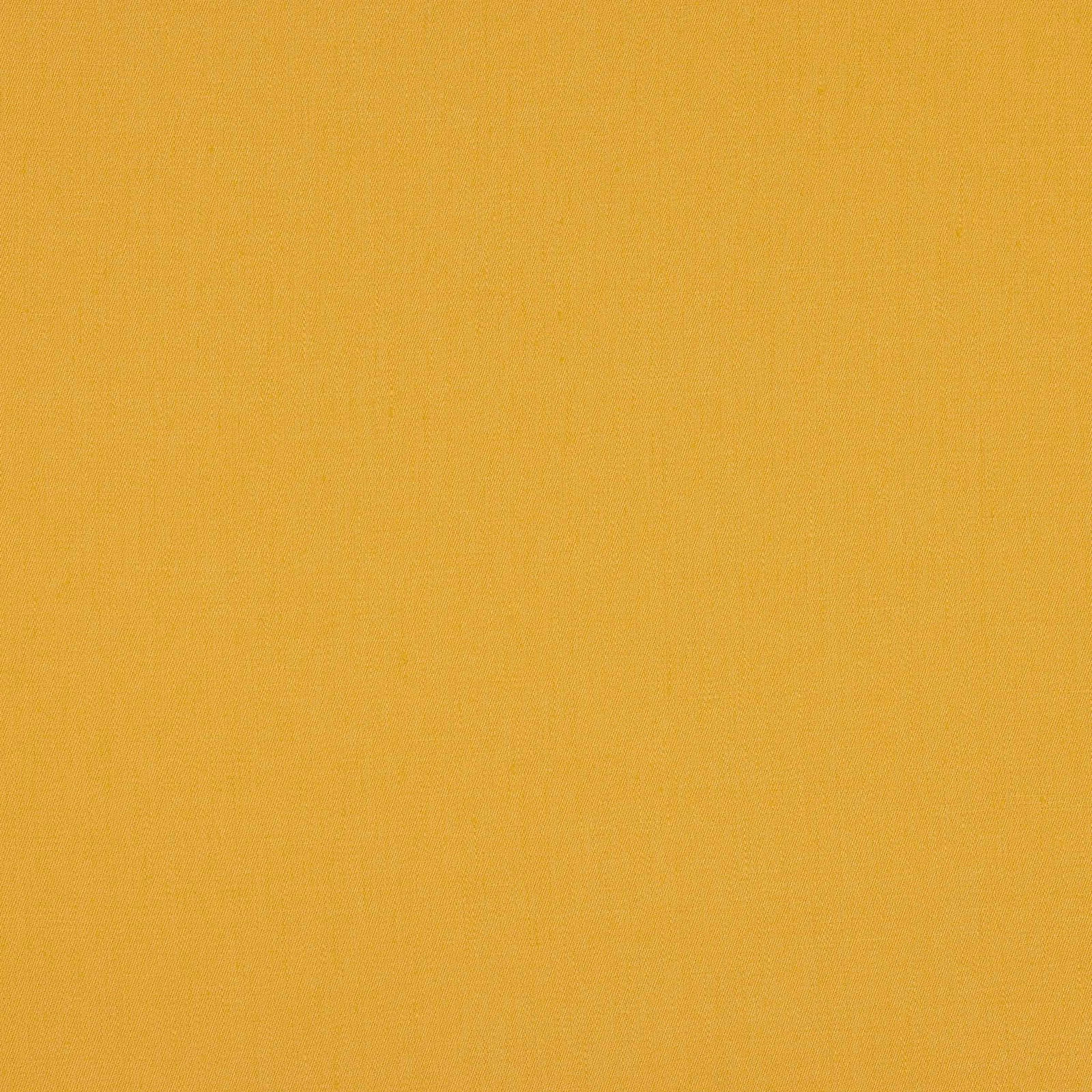 Solid saffron yellow linen swatch with a fine plain weave and matte texture