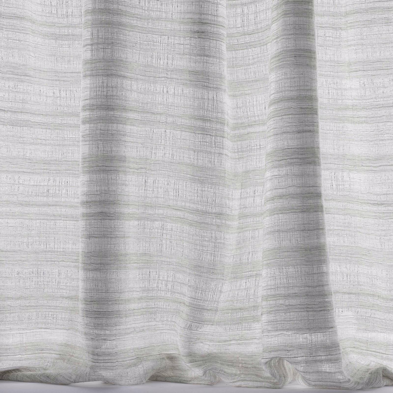 Pale silver-grey woven fabric with soft vertical folds and subtle slub texture