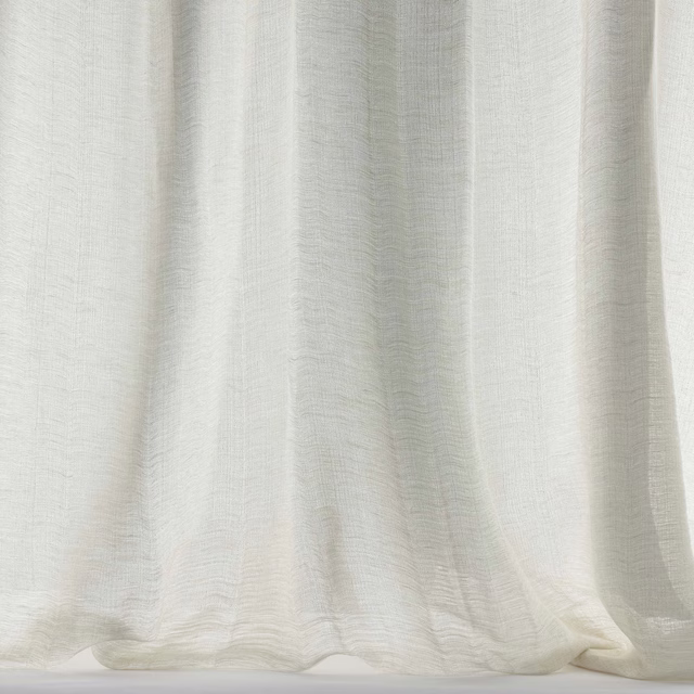 Soft cream linen-wool fabric draped in gentle folds with a matte texture