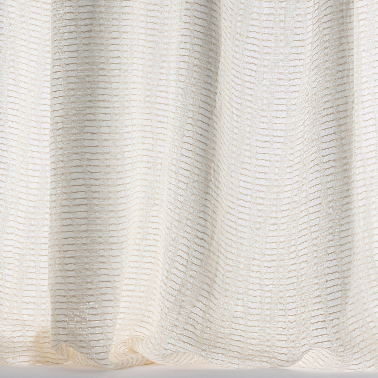 Creamy ivory woven fabric with a subtle horizontal ribbed texture and soft folds