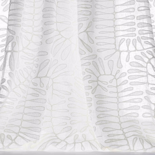 Sheer bone-white fabric with a large pale botanical outline pattern