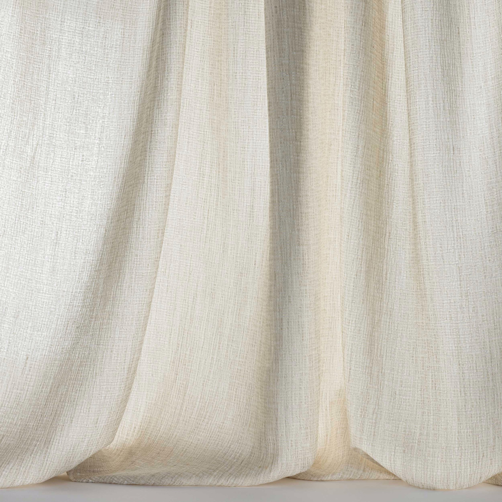 Pale cream woven fabric with soft clay warmth and gentle vertical folds