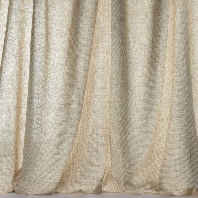 Soft sand beige textured fabric hanging in gentle vertical folds