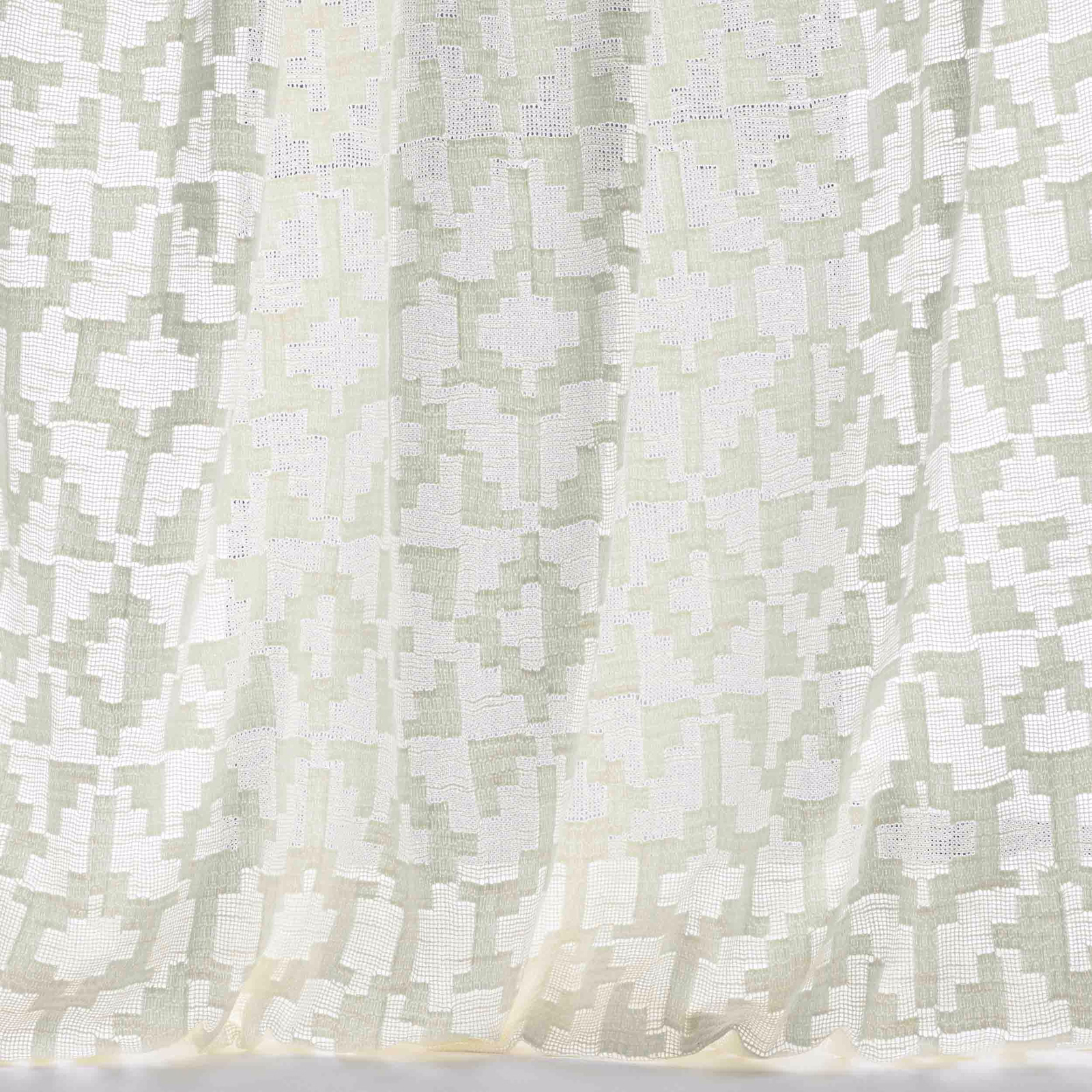 Pale bone cream geometric fabric with soft sage-grey blocks and a subtle woven texture
