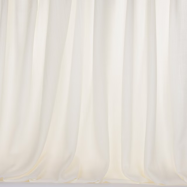 Soft ivory bone curtain fabric hanging in gentle vertical folds