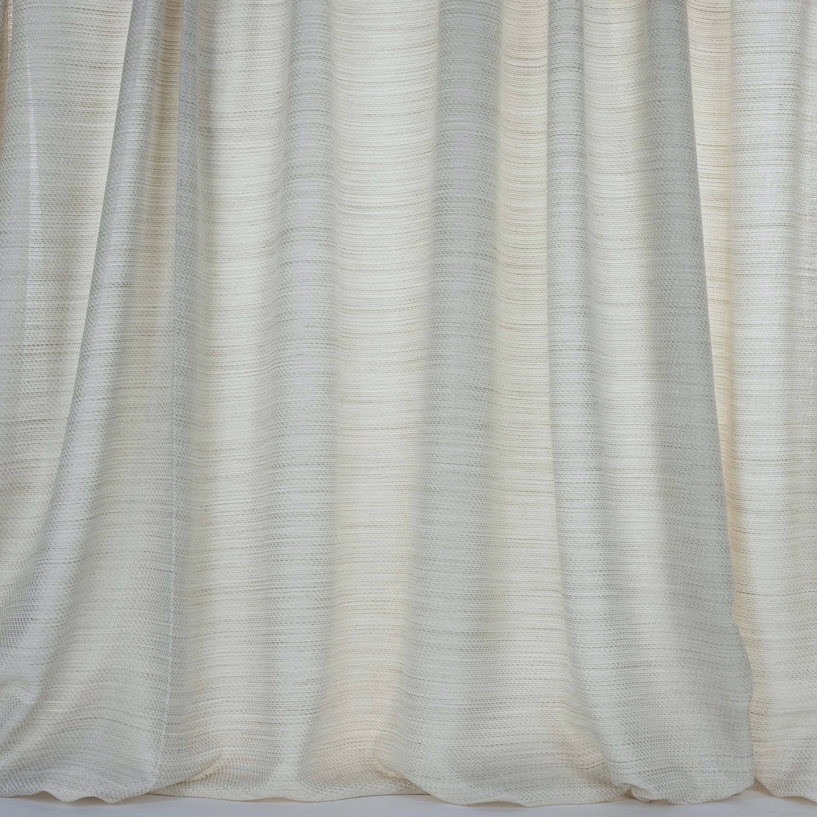 Soft ivory-beige curtain fabric with fine horizontal woven texture and gentle folds