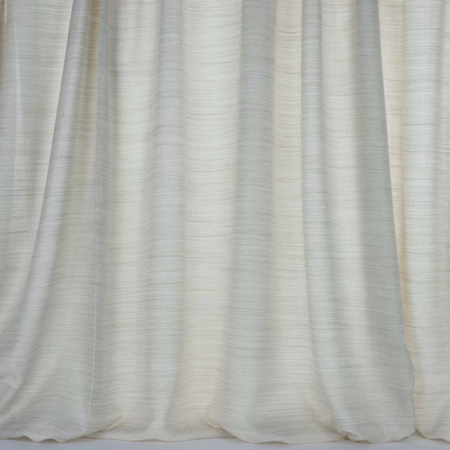 Soft ivory-beige curtain fabric with fine horizontal woven texture and gentle folds