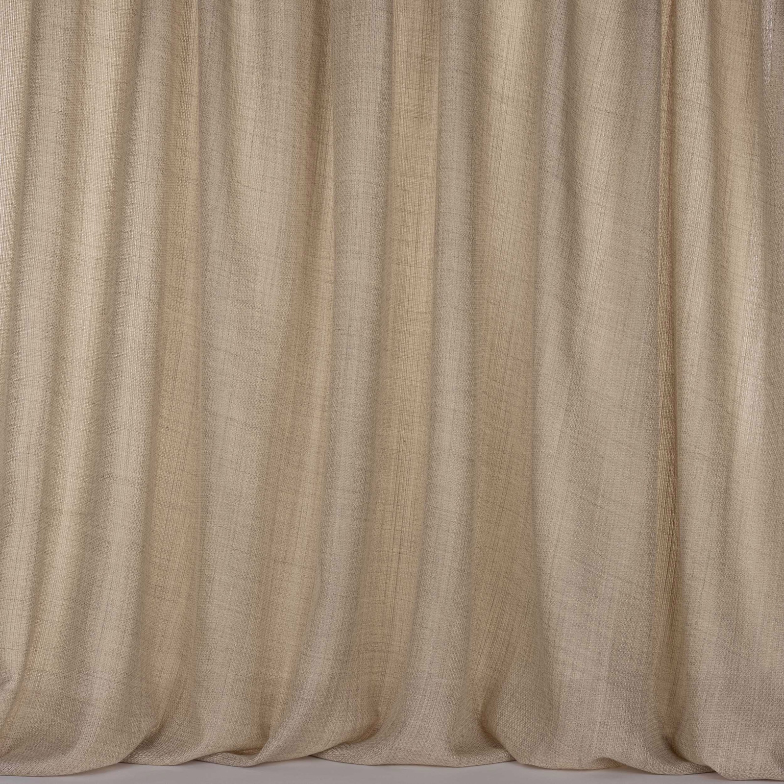 Soft sand-beige woven fabric shown in full drape with gentle vertical folds