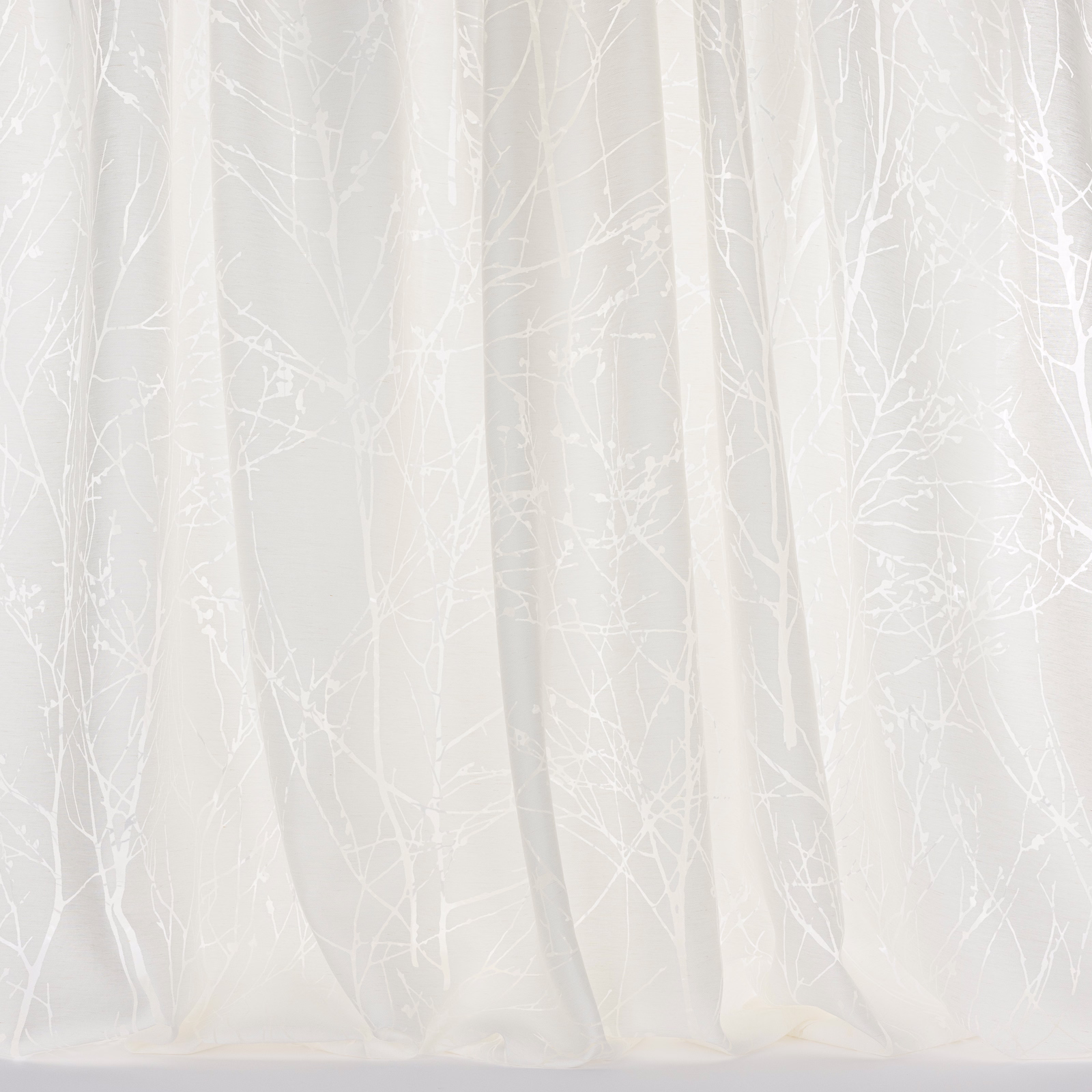 Sheer white curtain fabric with delicate frosted tree-branch motif