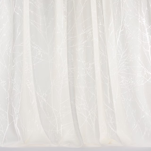 Sheer white curtain fabric with delicate frosted tree-branch motif