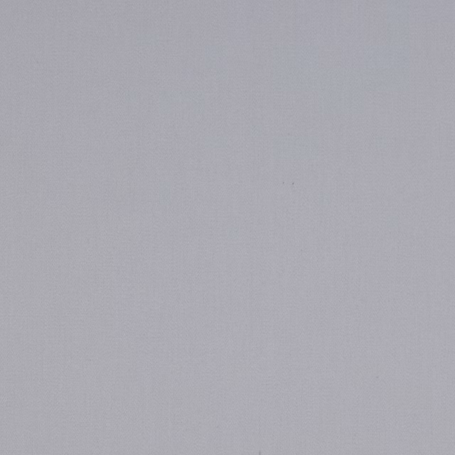 Pale cool grey plain cotton fabric swatch with a smooth matte texture