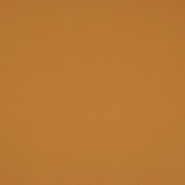 Solid amber-orange cotton fabric with a fine plain weave