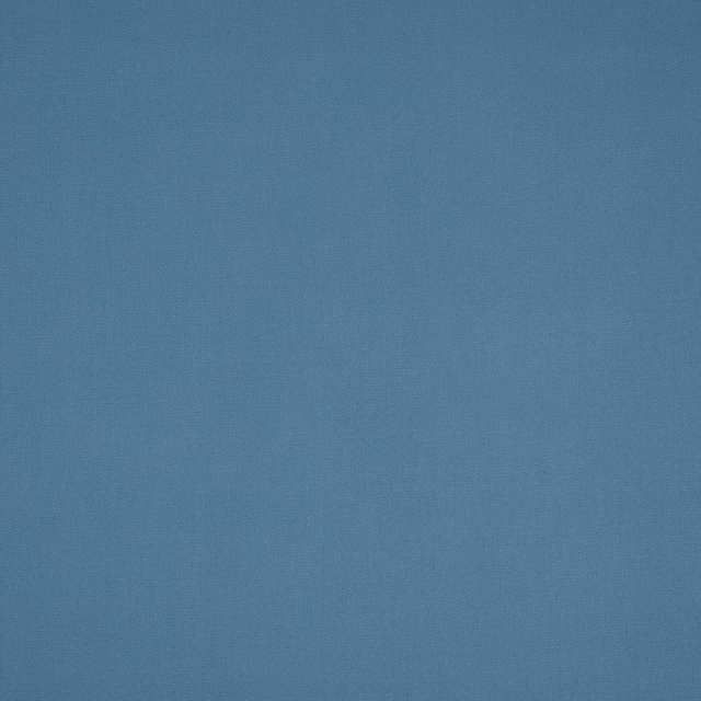 Soft muted blue plain cotton fabric with a fine woven texture