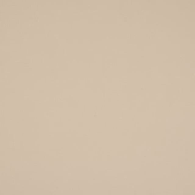Close-up of a plain soft warm beige cotton fabric swatch