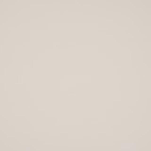 Plain soft cream cotton fabric swatch with a smooth matte weave