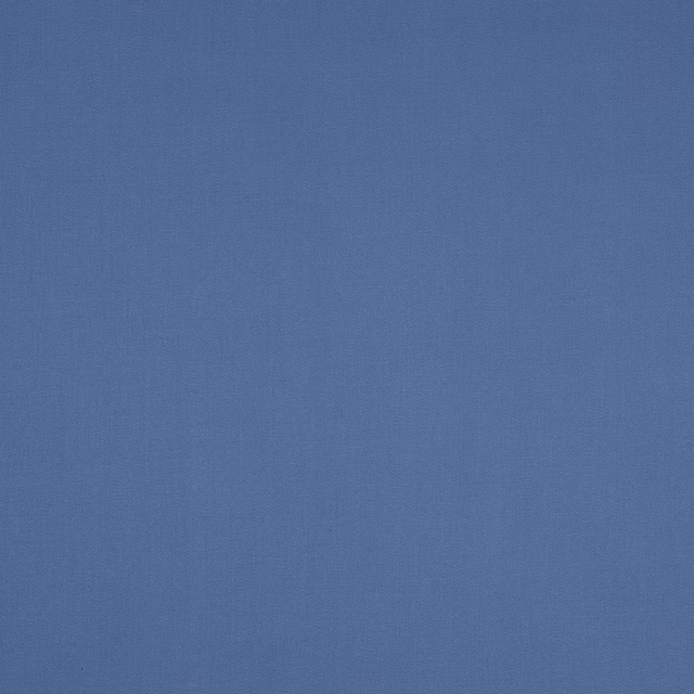 Muted denim-blue plain cotton fabric with a fine woven texture
