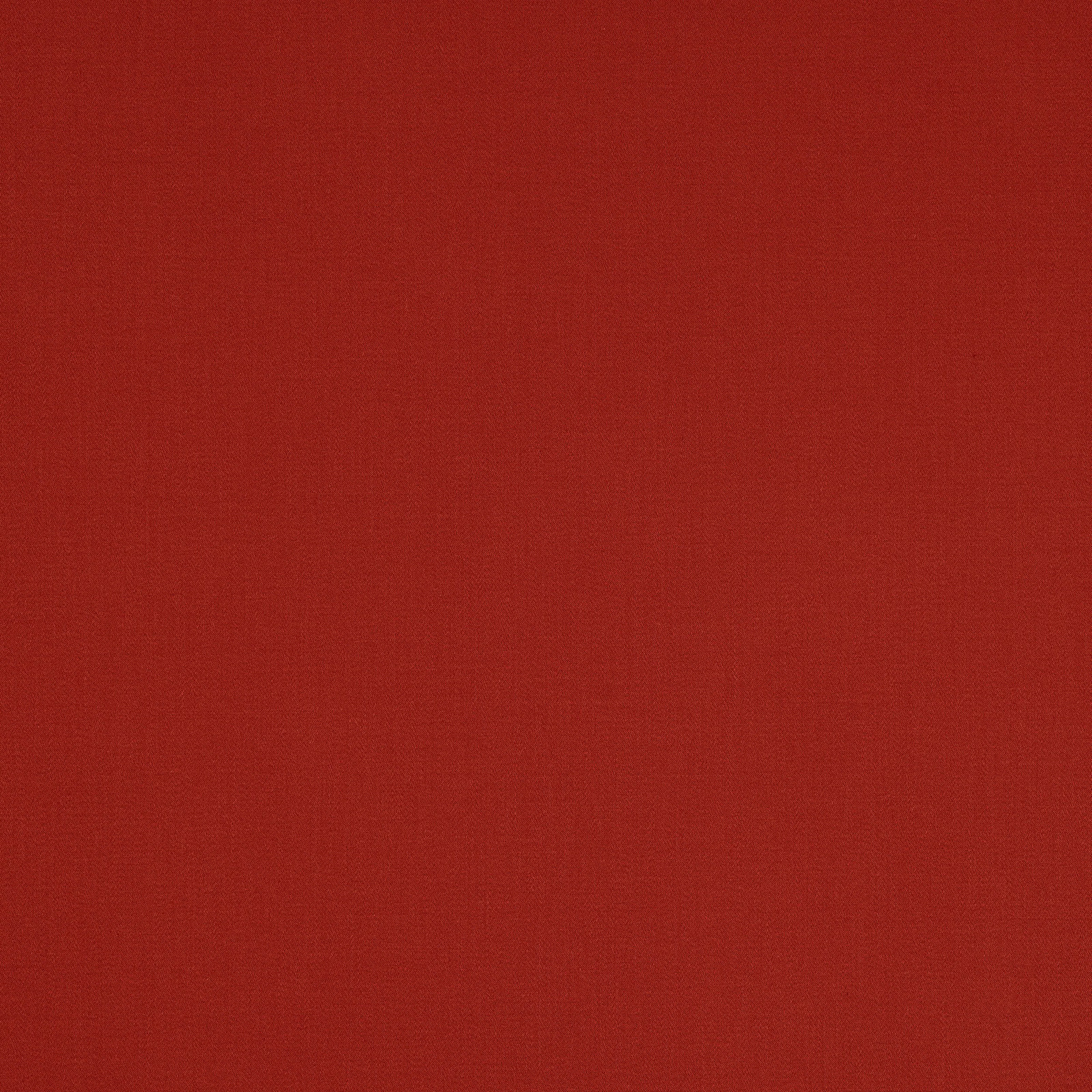 Deep burnt red cotton swatch with a fine, even woven texture