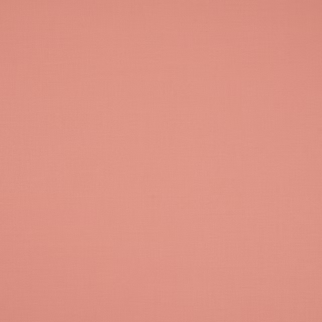 Soft coral pink plain cotton fabric with a fine matte weave