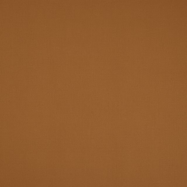 Warm caramel-brown plain woven cotton fabric swatch with a matte finish