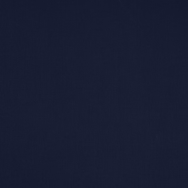Solid deep indigo blue cotton fabric swatch with a fine woven texture
