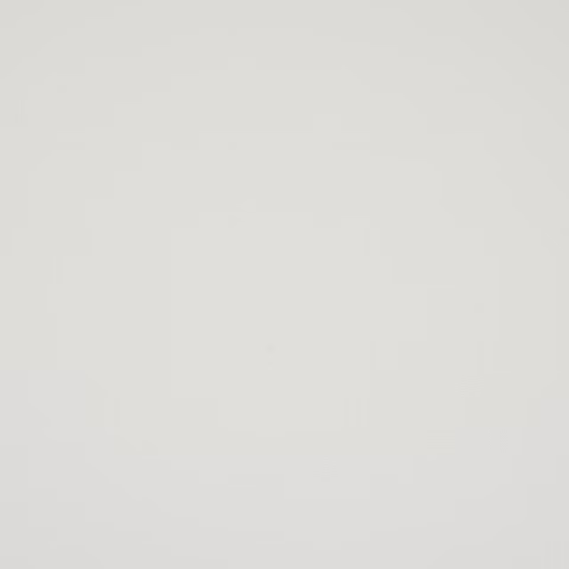 Soft ivory plain cotton fabric swatch with a smooth matte finish
