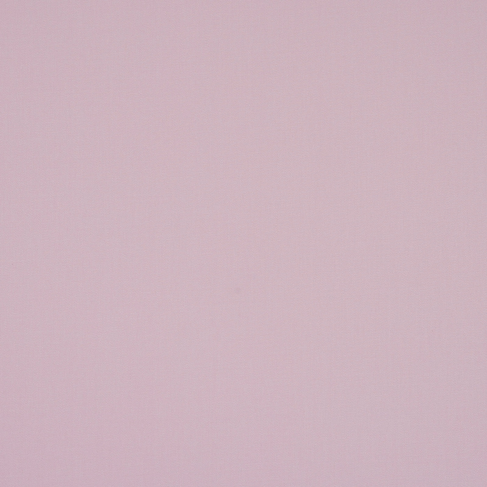 Pale dusty mauve plain cotton fabric with a soft matte texture