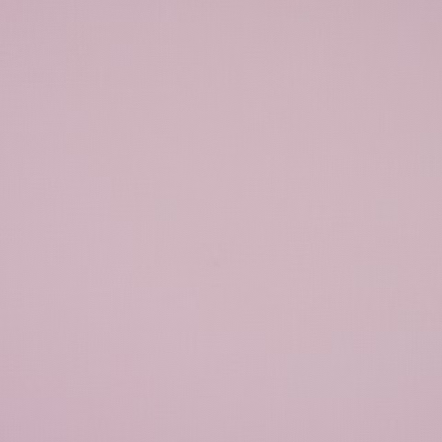 Pale dusty mauve plain cotton fabric with a soft matte texture